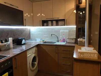 a kitchen with a sink and a washing machine at Apartament Odesos in Varna City