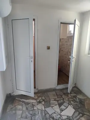 an empty room with a door and a mirror at Jacky's House in Chernomorets