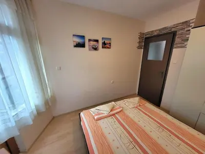 a small room with a bed in a room at Lux Apartment Sisi in Burgas City