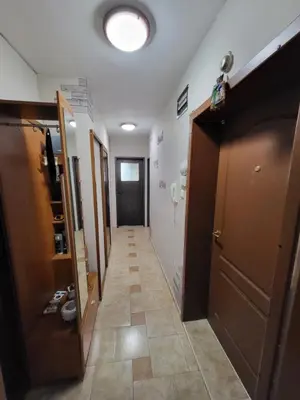 a hallway with a door and a tile floor at Lux Apartment Sisi in Burgas City