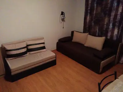 a living room with a couch and a chair at Galata in Varna City