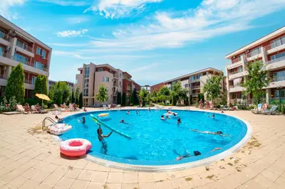 a group of people in a swimming pool at Nessebar Fort Club Apartments in Sunny Beach