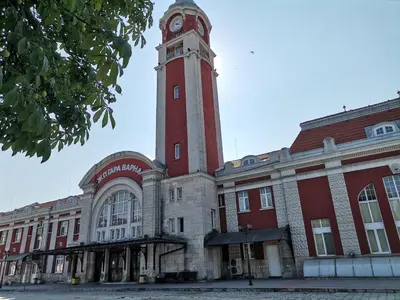 a building with a clock tower on top of it at Sunset House in Varna City