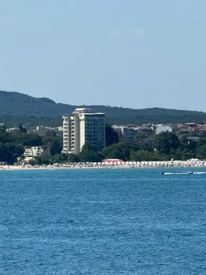 a large body of water with a city in the background at Perla Sun Beach Hotel - All Inclusive in Primorsko