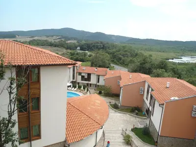 a view of a group of houses and a pool at Arkutino Family Resort in Sozopol