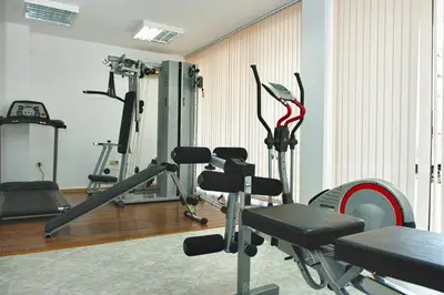 a gym with several exercise bikes and a treadmill at Royal Sun Apartments in Sunny Beach