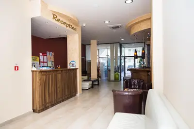 a lobby of a restaurant with a counter and chairs at Hotel St Valentine all inclusive in Sunny Beach