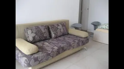 a couch sitting in a living room with at GoodRest Nesebar in Nesebar