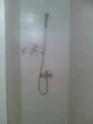 a shower with a shower head in a bathroom at GoodRest Nesebar in Nesebar
