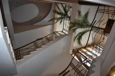an overhead view of stairs with a mirror and a plant at Kandrovi Sozopol in Sozopol
