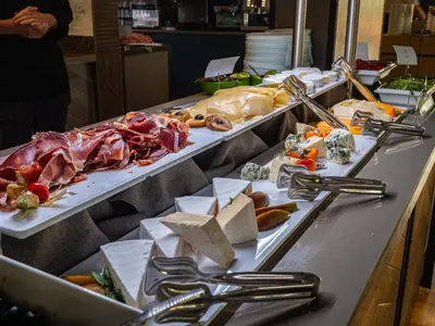 a buffet line with many different types of food at Aqua Paradise Resort & Aqua Park in Nesebar