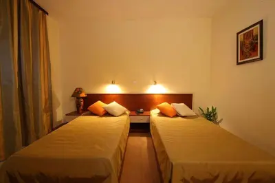 two beds in a hotel room with at Hotel Veris in Sunny Beach