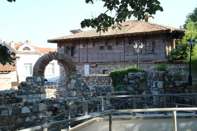 a stone building with an arch in front of it at Family Hotel Verona in Sozopol