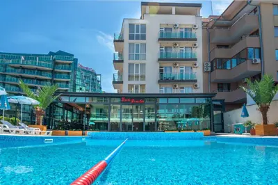a swimming pool in front of a building at Sveti Dimitar Hotel in Primorsko
