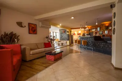 a living room with a couch and a table at Coral Guest House in Obzor