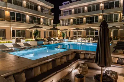 a pool in front of a hotel at night at Selena Beach Family Hotel - All Inclusive Light in Sozopol