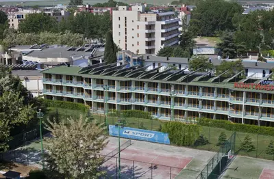 a large building with a hotel sign in a city at Continental Park Hotel in Sunny Beach