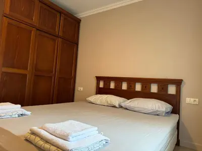 a bedroom with two beds with towels on them at Santa Marina Apartment 513 in Sozopol