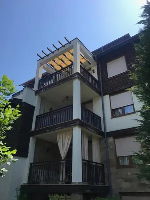 a large building with a balcony with a window at Santa Marina Apartment 513 in Sozopol