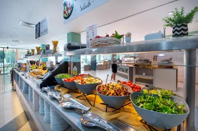 a buffet line with bowls of food on display at MPM Hotel Kalina Garden - All Inclusive in Sunny Beach