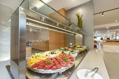 a buffet with many different types of food on display at Martinez Hotel All Inclusive in Sozopol