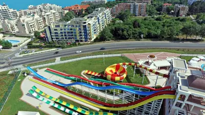 a water park in a city with a roller coaster at Aparthotel Marina Holiday Club - All Inclusive & Free Parking in Pomorie
