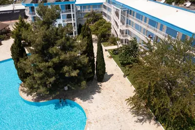 an aerial view of a resort with trees and a building at Hotel Azurro - All Inclusive in Sunny Beach