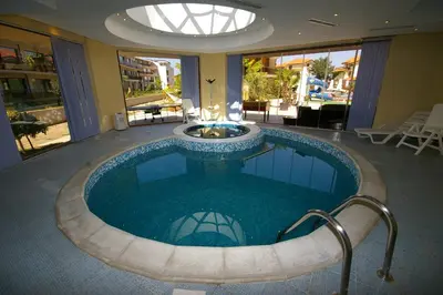a large swimming pool in a house at Laguna Beach Resort & Spa in Sozopol