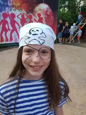 a little girl with a face painting on her face at Aquamarine Hotel - All Inclusive in Sunny Beach