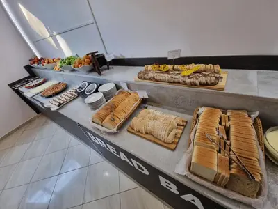 a buffet line with many different types of food at Aquamarine Hotel - All Inclusive in Sunny Beach