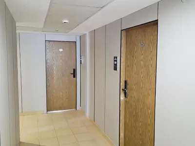 a hallway with two doors and a tile floor at Bora Bora Hotel in Sunny Beach
