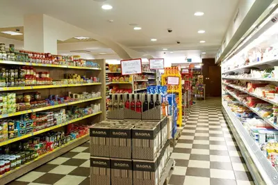 a store aisle of a grocery store filled with products at Santa Marina Holiday Village in Sozopol