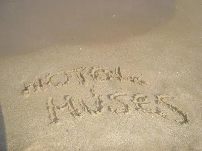 a message written in the sand on the beach at Family Hotel Muses in Sozopol