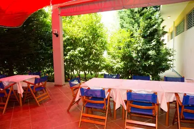 a table and chairs sitting on a patio at Ivana Palace Hotel - Free Parking in Sunny Beach