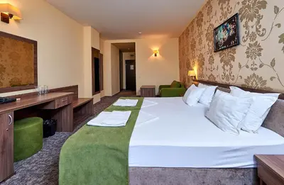 a hotel room with a bed and a television at Sunny Beach Hotel Forum - All Inclusive in Sunny Beach