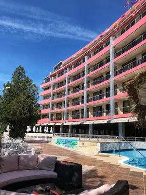a large building with a pool in front of it at Flamingo Hotel Sunny Beach in Sunny Beach
