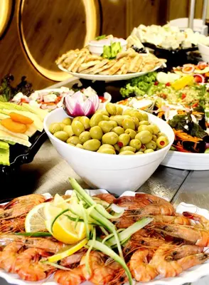 a buffet of food with shrimp and other foods at Barcelo Royal Beach - All Inclusive in Sunny Beach