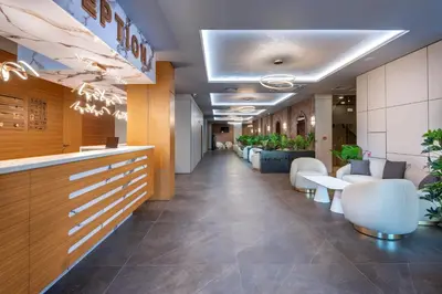 a lobby of a hospital with chairs and a bar at Marieta Palace Hotel in Nesebar