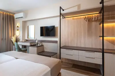 a hotel room with a bed and a desk at Marieta Palace Hotel in Nesebar