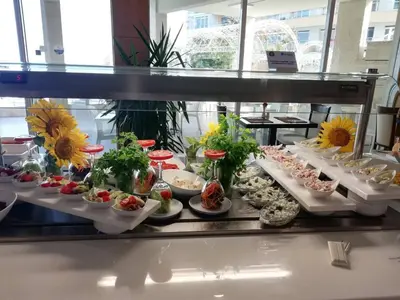 a display case with many different types of food at Bilyana Beach Hotel- Adults only in Nesebar
