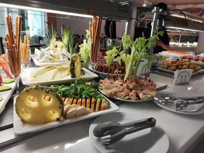 a buffet with many plates of food on a table at Bilyana Beach Hotel- Adults only in Nesebar