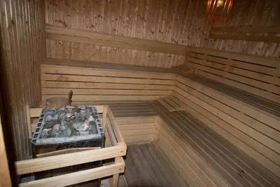a inside of a sauna with a tray of rocks at Marina Cape Vacation Complex in Ravda