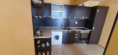 a small kitchen with a sink and a washing machine at Alex Beach Apartment in Sveti Vlas