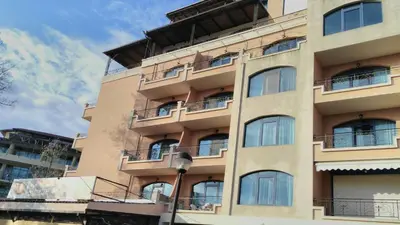 a tall building with balconies on the side of it at Villa Bonita Apartment in Sunny Beach