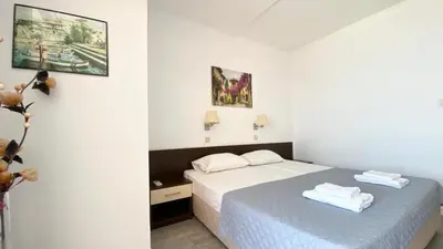 a bedroom with a bed with towels on it at Carina Beach in Sunny Beach