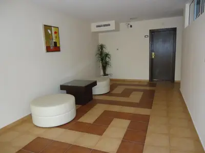 a room with two stools and a table and a door at Tropics Hotel - Ultra All Inclusive in Sveti Vlas