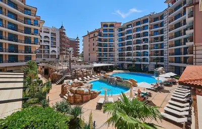 a resort with a swimming pool and some buildings at Karolina Hotel in Sunny Beach