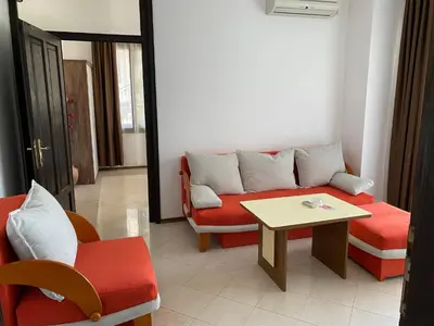 a living room with a couch and a table at Villas Sozopol in Sozopol
