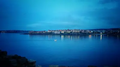 a large body of water with a city in the background at Villas Sozopol in Sozopol