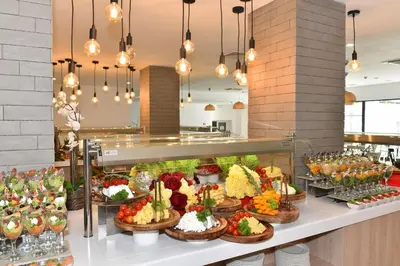 a buffet with many different types of food on display at iHotel Sunny Beach in Sunny Beach
